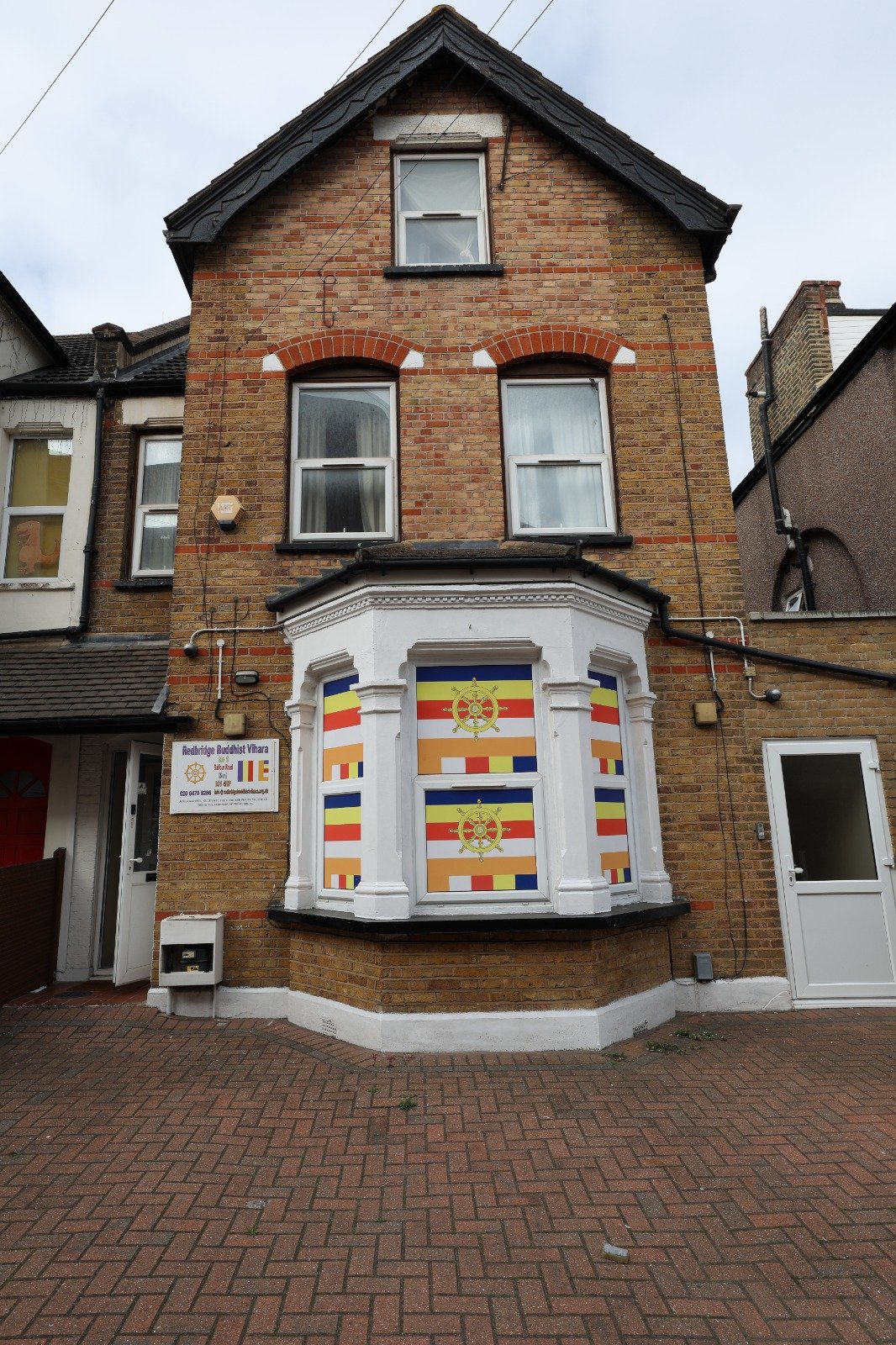 The Vihara's frontage on Balfour Road &mdash; look for the Dharmacakra flags in the bay window